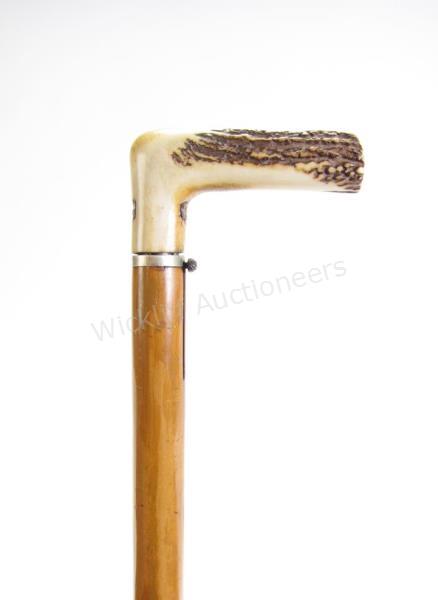 Appraisal: Dumonthier Gun Cane combination wood and metal shaft separates to