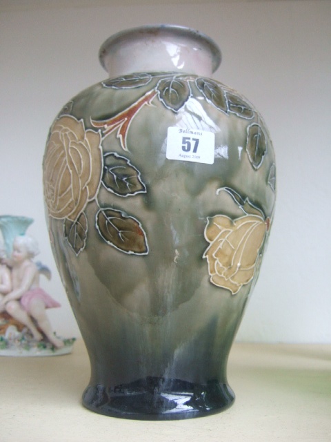 Appraisal: A Royal Doulton saltglaze stoneware baluster shaped vase decorated with