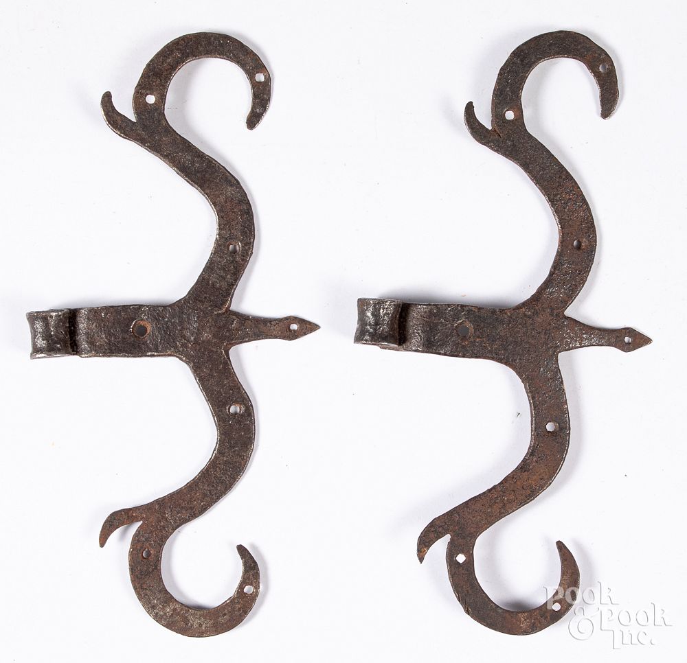 Appraisal: Pair of wrought iron rams horn hinges Pair of wrought