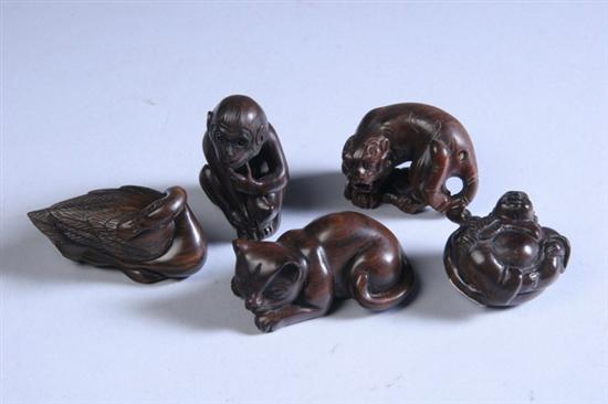 Appraisal: FIVE JAPANESE WOOD NETSUKE th century Carved to depict tiger