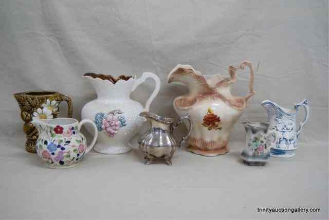 Appraisal: Misc Ceramic Pottery Pitchers CreamersDifferent sizes styles and designs with