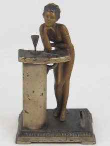 Appraisal: A spelter table cigar lighter in the form of a