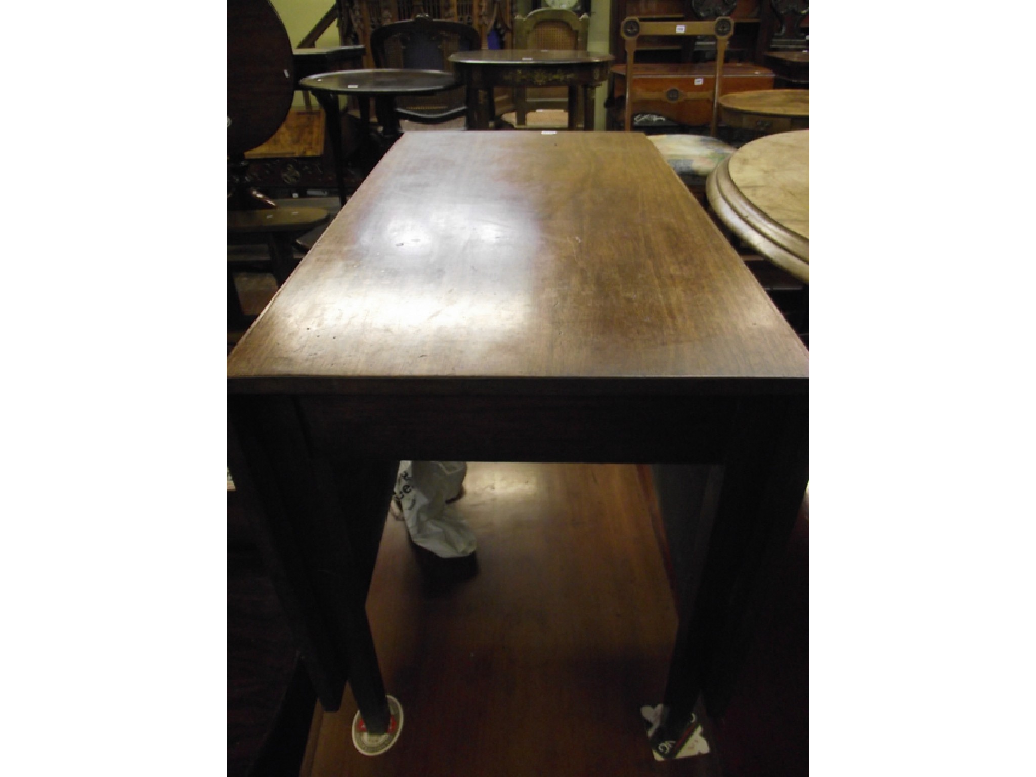 Appraisal: An early th century mahogany drop leaf dining table on