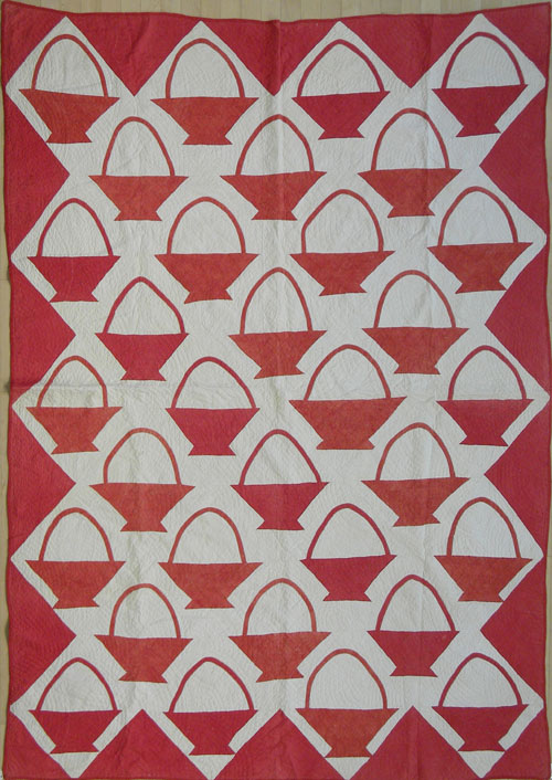 Appraisal: Red and white pieced quilt in a basket pattern together