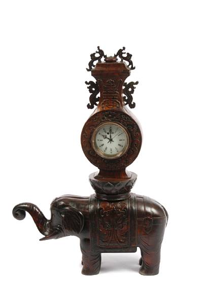 Appraisal: A carved wood Chinese figural elephant clock in three parts