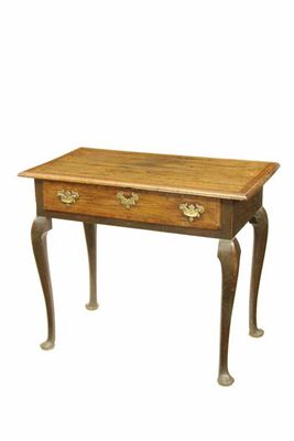 Appraisal: An early th century oak side table with fruitwood crossbanding