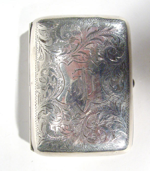 Appraisal: Rectangular silver cigarette case chased with leaves Chester cm long