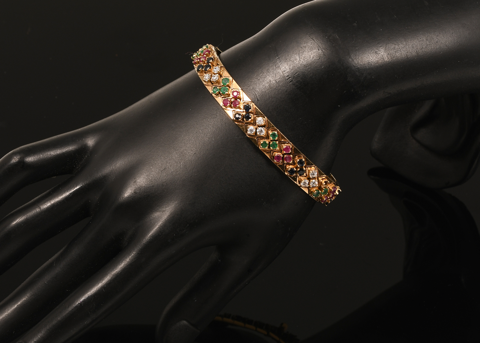 Appraisal: K YELLOW GOLD GEMSTONE BRACELET A rainbow of color featuring