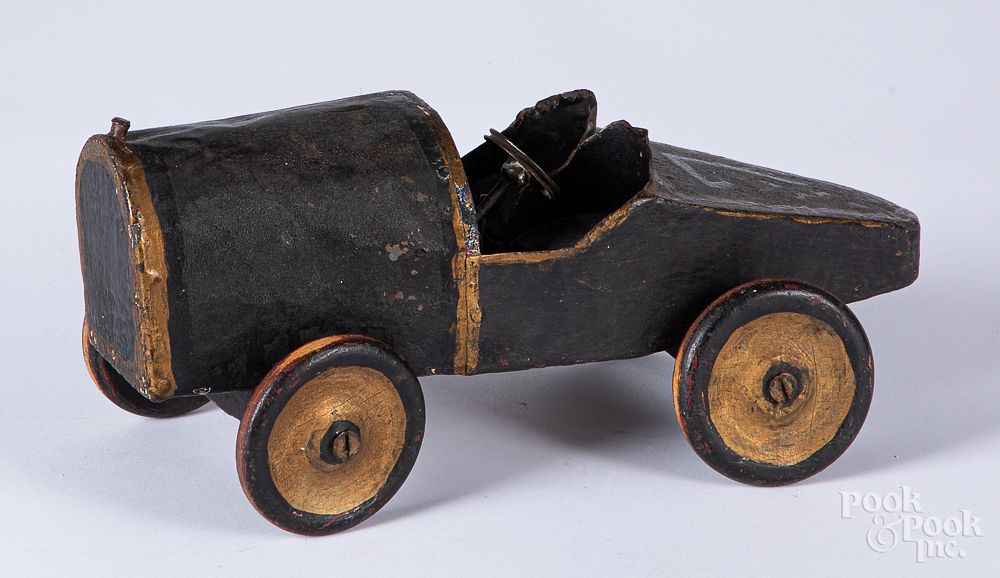 Appraisal: Folk art painted tin and wood open wheel race car