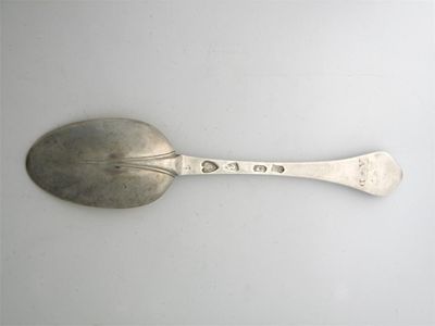 Appraisal: A Queen Anne wavyend spoon with a thread bordered rattail