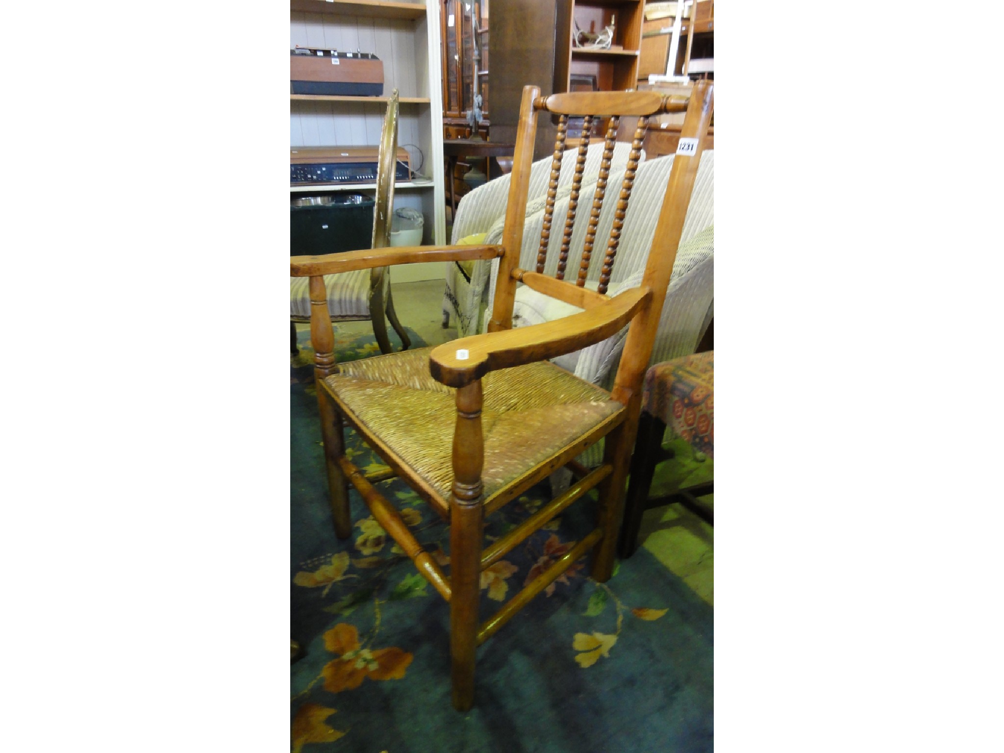 Appraisal: A th century countrymade fruit wood open elbow chair with