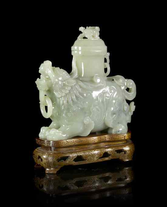 Appraisal: A Jade Model of a Beast of semi-transparent pale celadon