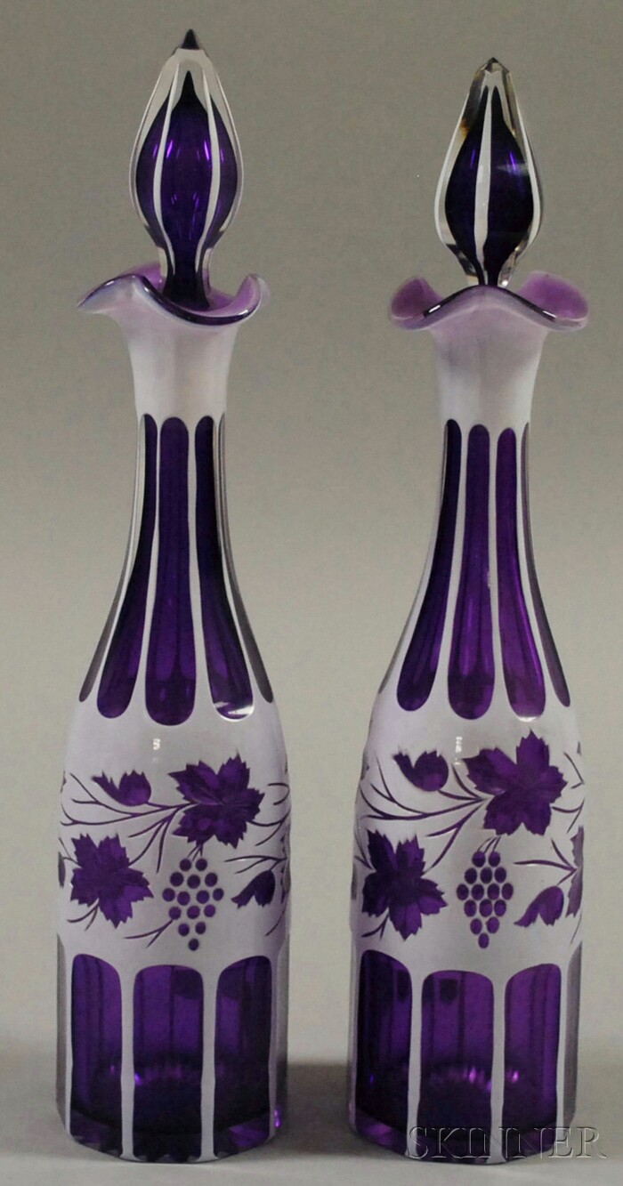 Appraisal: Pair of Bohemian Cased White-cut-to-Amethyst Art Glass Decanters approx ht