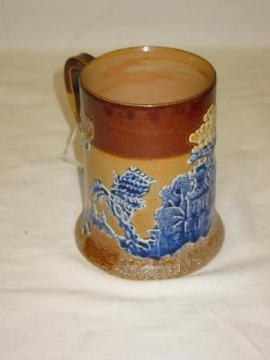 Appraisal: A DOULTON LAMBETH STONEWARE TANKARD of cylindrical form with spreading