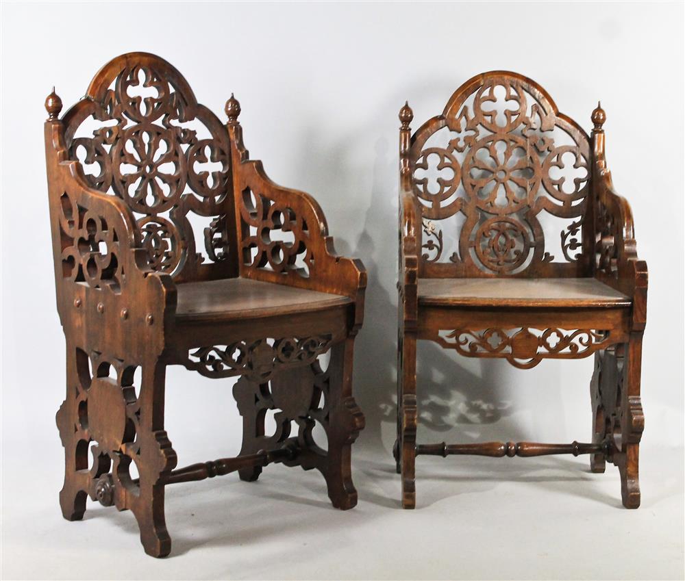 Appraisal: PAIR OF GOTHIC REVIVAL CARVED OAK HALL CHAIRS BY URQUHART