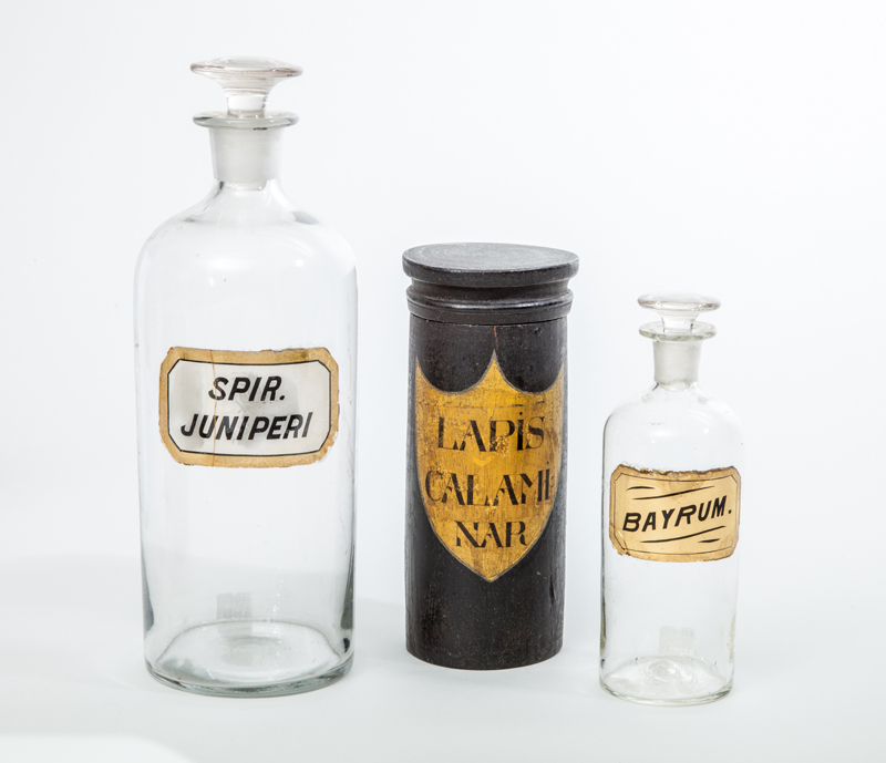 Appraisal: TWO GLASS APOTHECARY JARS AND STOPPERS AND A BLACK PAINTED