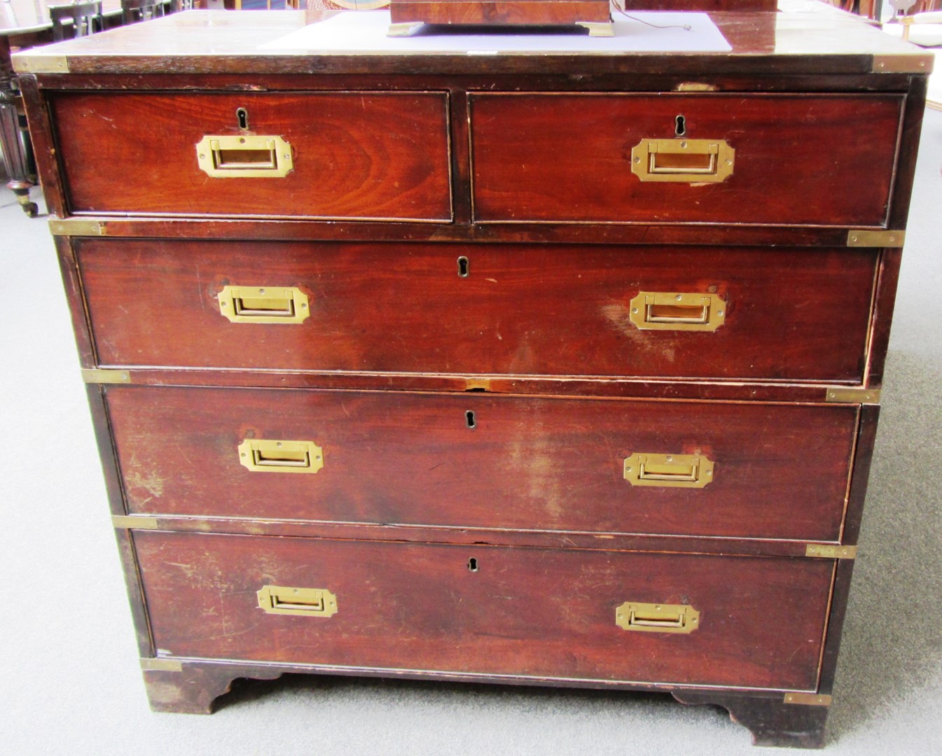 Appraisal: A th century mahogany campaign style brass bound chest of