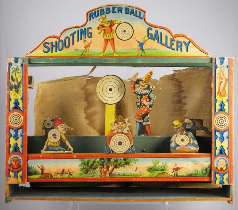 Appraisal: Early Paper-On-Wood Rubber Ball Shooting Gallery Description Very nice lithography