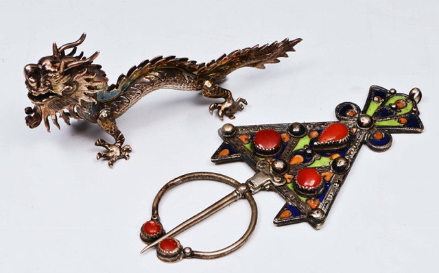 Appraisal: A MIDDLE EASTERN ENAMEL AND CORAL SET CLOAK PIN in