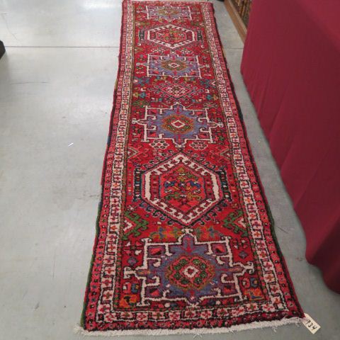 Appraisal: Heriz Persian Handmade Runner geometrics medallions stylized florals red field