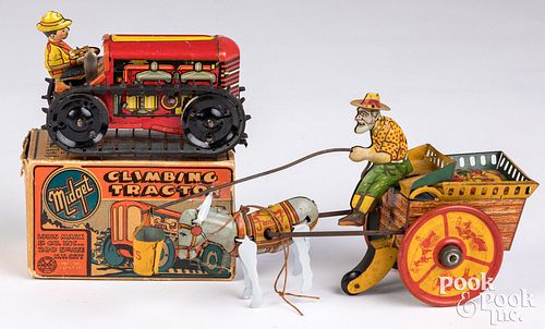 Appraisal: TWO LITHOGRAPHED TIN TOYSTwo lithographed tin toys to include Strauss