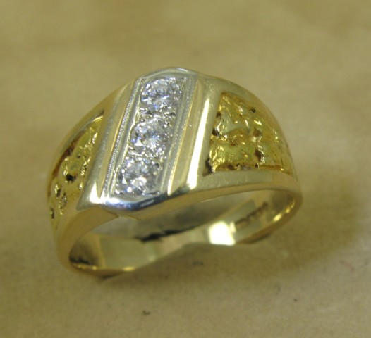 Appraisal: MAN'S DIAMOND AND FOURTEEN KARAT GOLD RING set with a