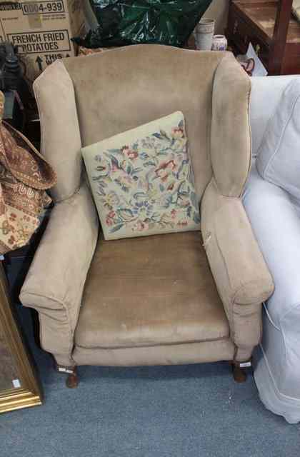 Appraisal: A PINK UPHOLSTERED GEORGIAN STYLE WING BACK ARMCHAIR approx wide