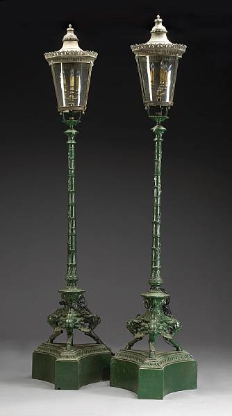 Appraisal: A pair of Aesthetic style painted iron and glass torch