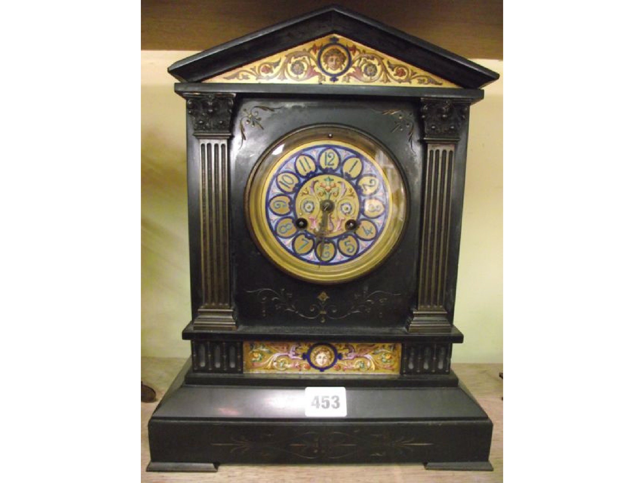 Appraisal: A Victorian black slate mantle clock with painted brass dial