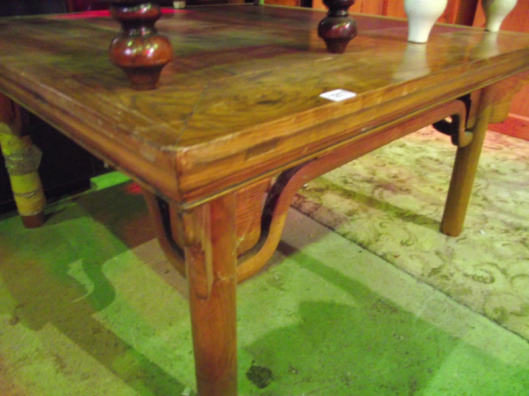 Appraisal: A Chinese elm occasional table of low cut form raised