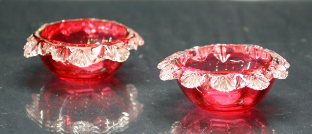 Appraisal: Pair of ruby glass salts with clear glass frilled lips