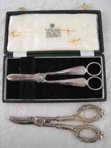 Appraisal: A pair of silver grape shears hallmarked Sheffield boxed together