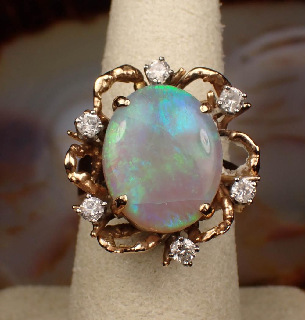 Appraisal: AUSTRALIAN OPAL DIAMOND AND FOURTEEN KARAT GOLD RING The yellow