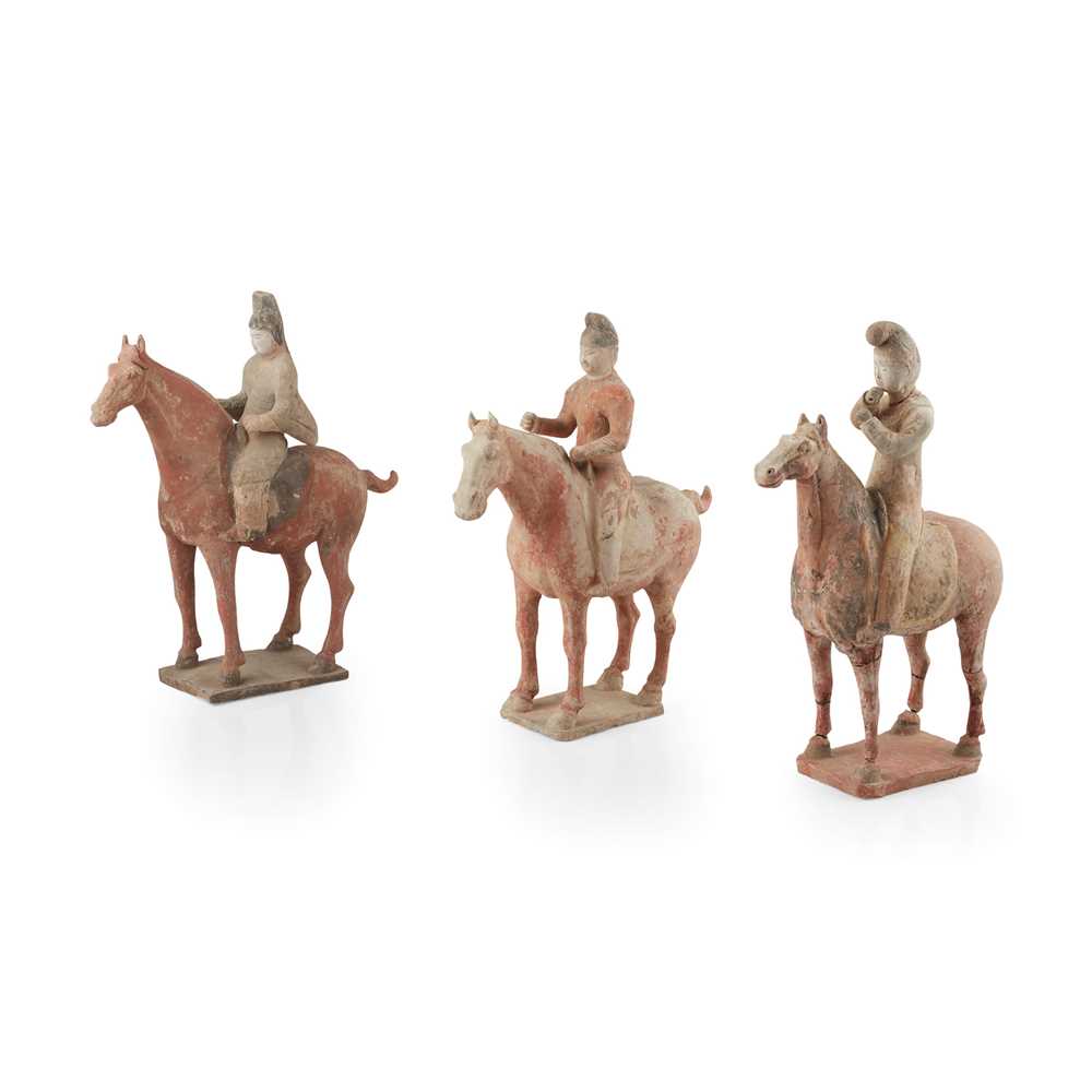 Appraisal: GROUP OF THREE PAINTED POTTERY HORSES AND RIDERS TANG DYNASTY