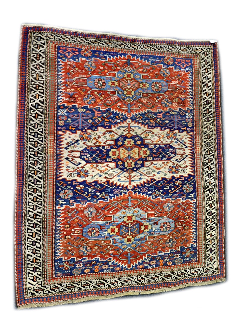 Appraisal: A Shirvan rug with three red white and blue rectangular