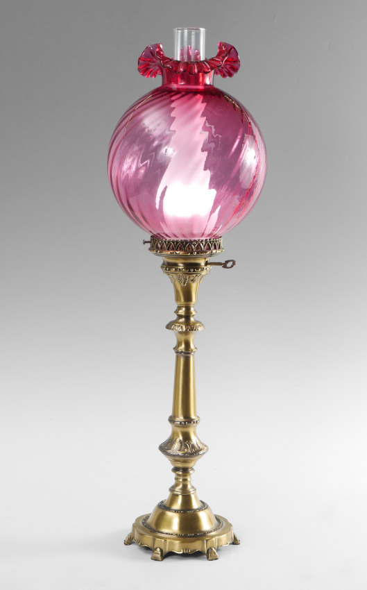 Appraisal: CRANBERRY GLASS SHADE BRASS TABLE LAMP Heavy cast brass base