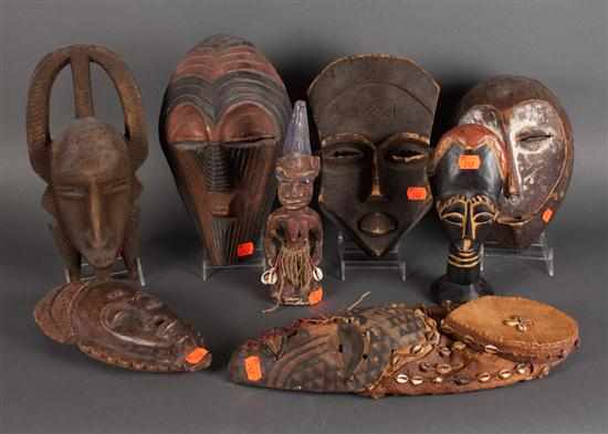 Appraisal: Six African carved wood masks and two other art objects