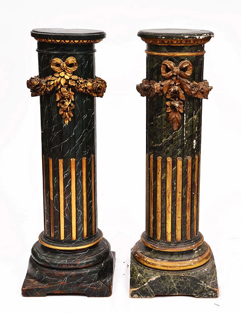 Appraisal: A PAIR OF SIMULATED MARBLE FLUTED COLUMNS with carved giltwood