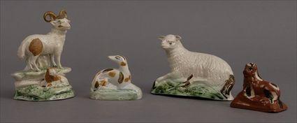 Appraisal: FOUR STAFFORDSHIRE ANIMAL FIGURES Comprising a group of a ram