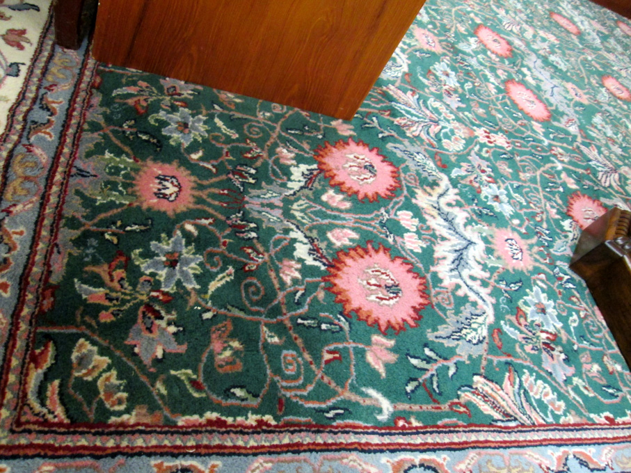 Appraisal: HAND KNOTTED ORIENTAL CARPET Indo-Persian overall repeating floral row design