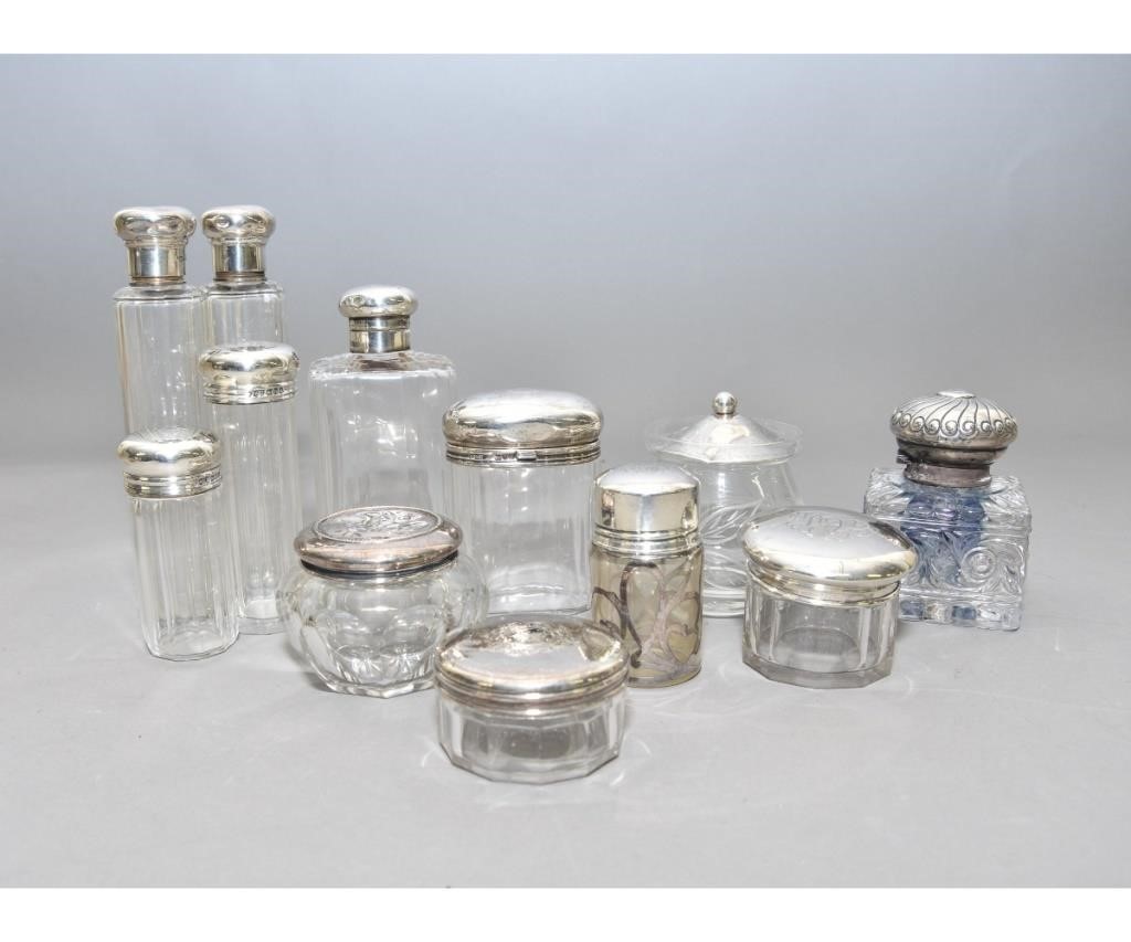 Appraisal: Twelve English sterling silver and glass dresser bottles circa tallest