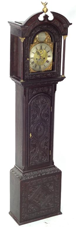 Appraisal: OGDEN DARLINGTON A CARVED STAINED OAK LONGCASE CLOCK with broken