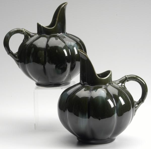 Appraisal: HAMPSHIRE Attr Pair of melon-shaped pitchers in dark green glaze