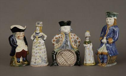 Appraisal: Four Continental Polychrome Faience Figure Jugs and Bottles Modern Jug