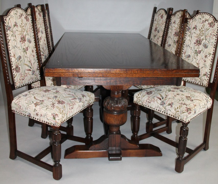 Appraisal: A modern Ercol style refectory dining table and six chairs