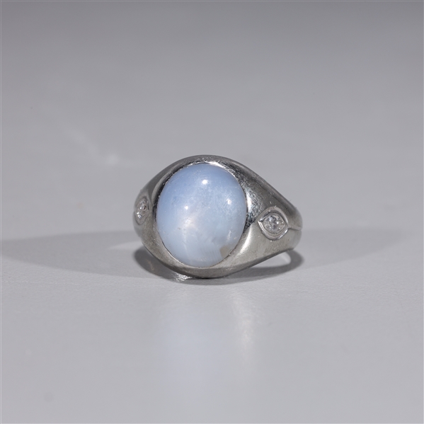 Appraisal: K white gold ring with star sapphire and two marquise