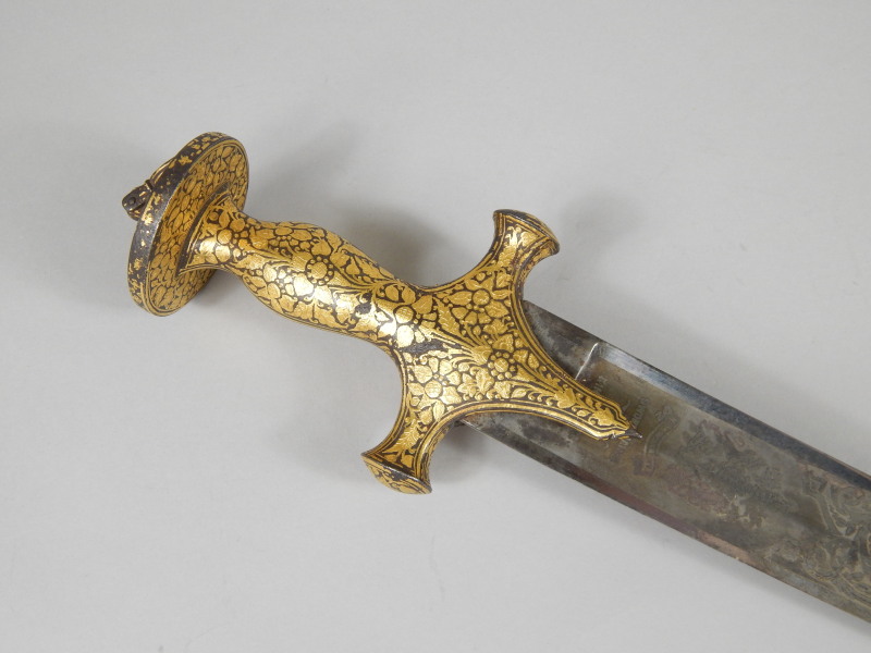 Appraisal: An Indian Tulwar the iron hilt decorated with gold koftgari