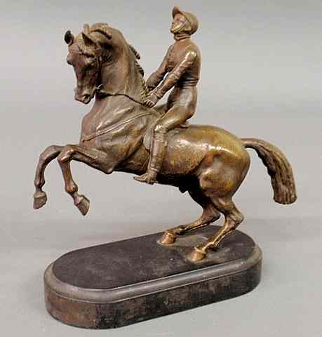 Appraisal: French bronze of a jockey on a prancing horse late