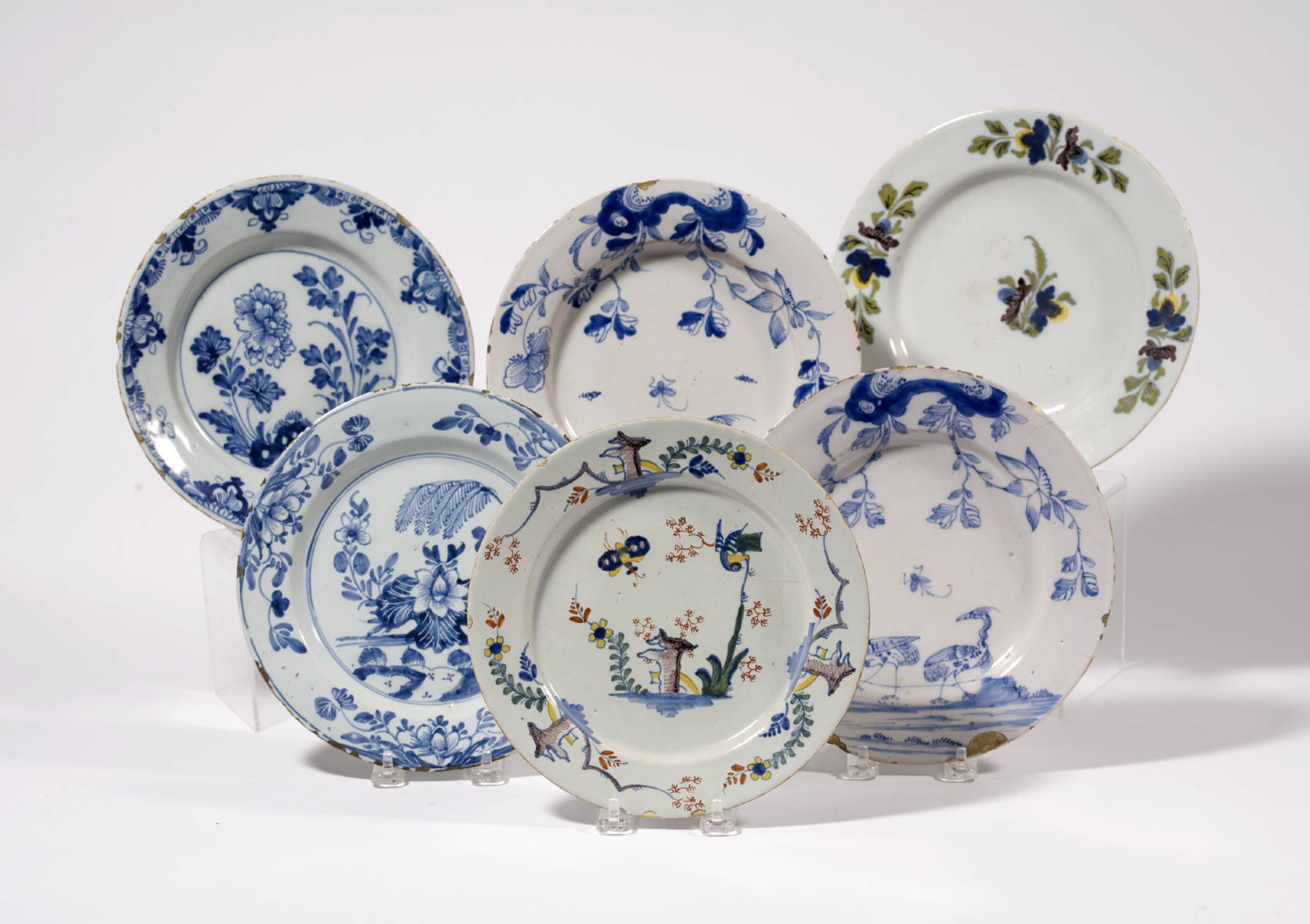 Appraisal: SIX ENGLISH DELFT PLATES INCLUDING A POLYCHROME EXAMPLE AND FOUR