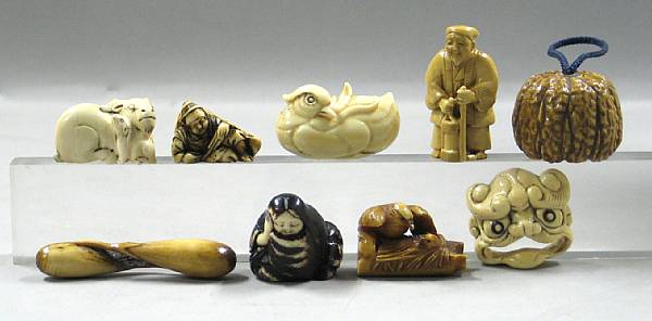 Appraisal: A group of eight ivory netsuke and small carvings Two